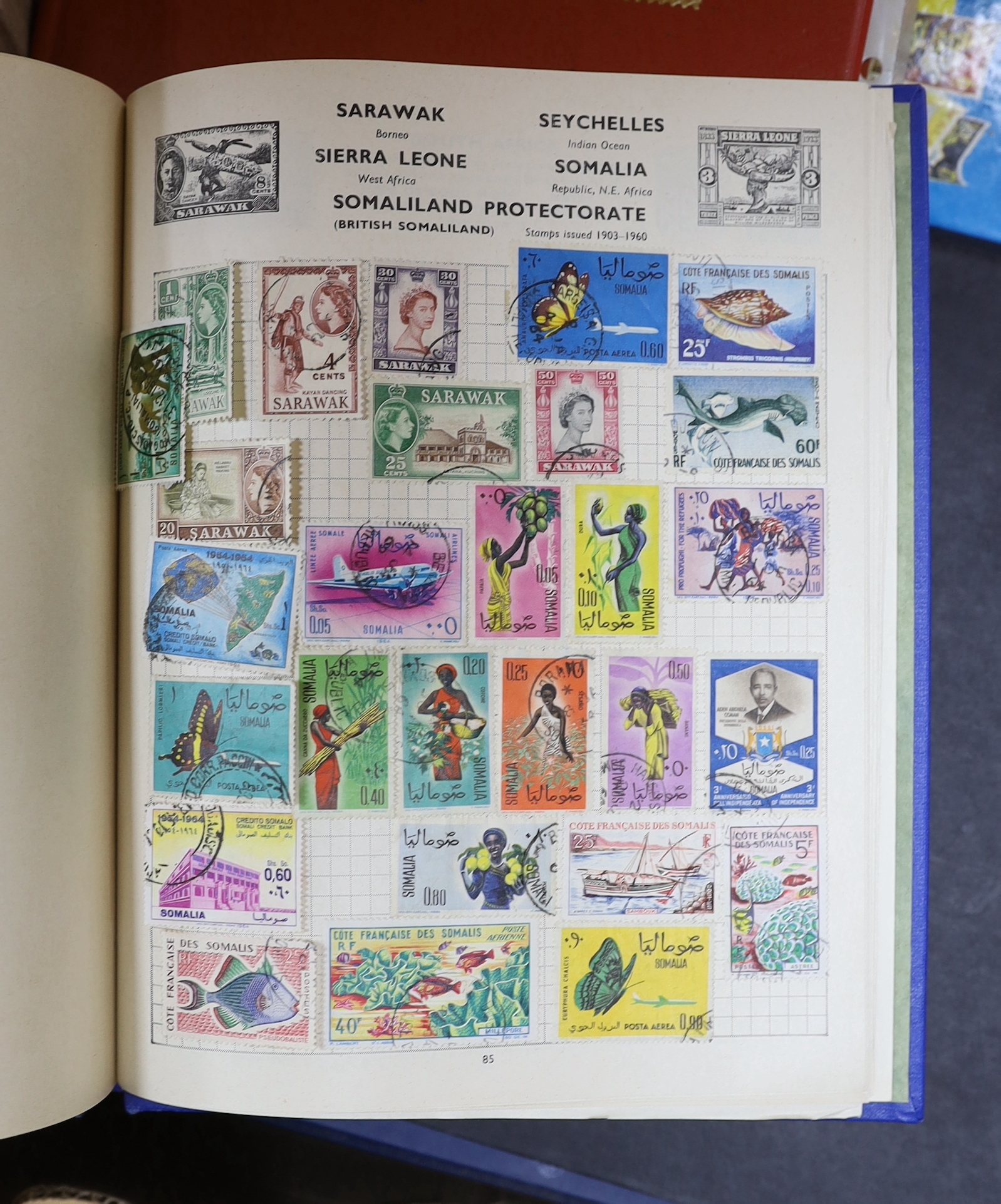 A collection of stamps arranged in albums including Romanian and Indian examples